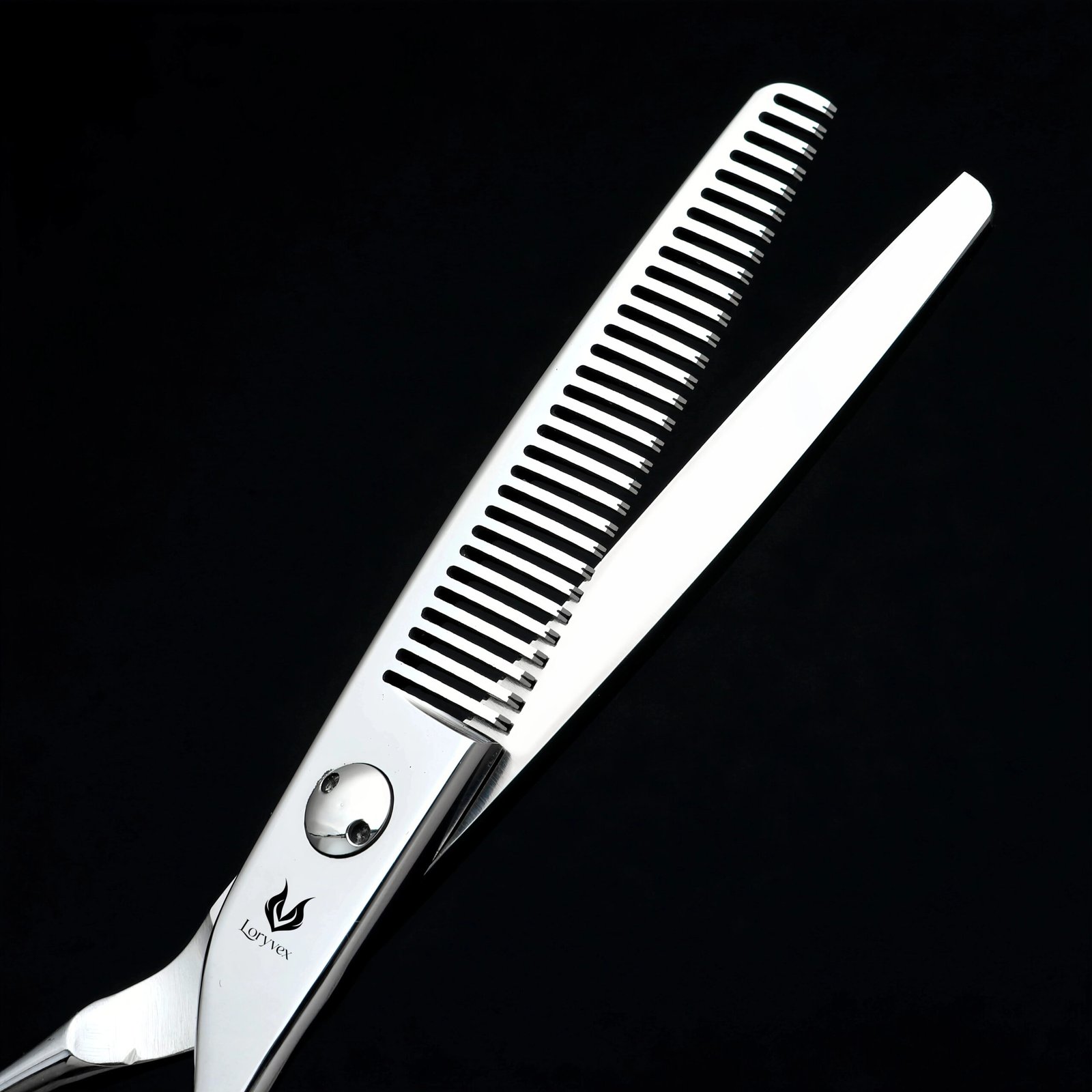 Close-up of the teeth and blade of polished silver thinning shears
